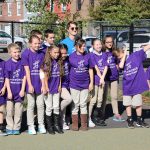 A group of Adaire Playworks Junior Coaches pose for a photo during school yard opening ceremony.